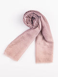Pink scarf with glittery texture on a white background