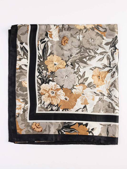 Floral patterned scarf with black border on a white background